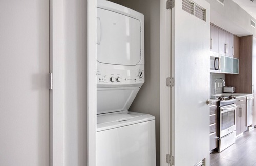 Buzzard Point Apartment | Chic Navy Yard 1BR w/W/D, Roof BBQ & Gym, near Nats Park, by Blueground