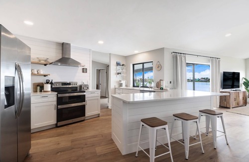 Eight Lakes House | Chic Remodel! Gulf-Access Waterfront! Heated Pool, Kayak, Bikes & Over $125 of Free Daily Activities