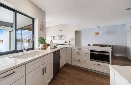 Eight Lakes House | Chic Remodel! Gulf-Access Waterfront! Heated Pool, Kayak, Bikes & Over $125 of Free Daily Activities