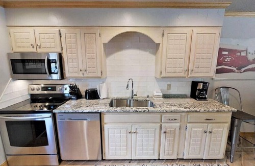 Red River House | CJ Townhouse 3 - On the River - In Town - Across from the Fishing Ponds - Wood B