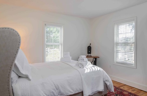 Hendersonville Cottage | Classic white farmhouse style cottage. Perfect for a serene country getaway.