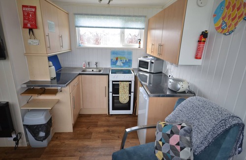 Stalham Ski Chalet | Close to Broads,WIFI,heated,2 Bed,Seasonal Swimming Pool, No Pets.