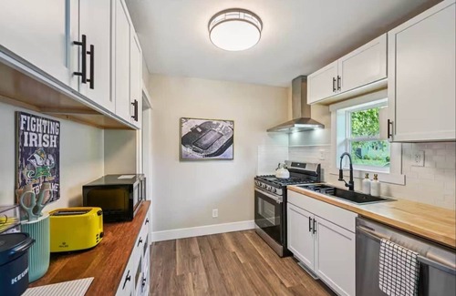 Northeast South Bend House | Clover Cottage Walk to Notre Dame, Game Room, Enclosed Porch, 3 queen beds