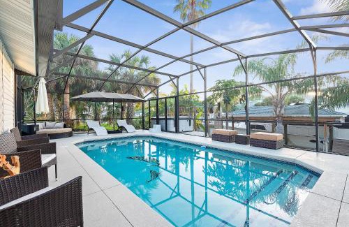 Palm Harbor House | Coastal Canal Front Retreat with Pool & Hot Tub