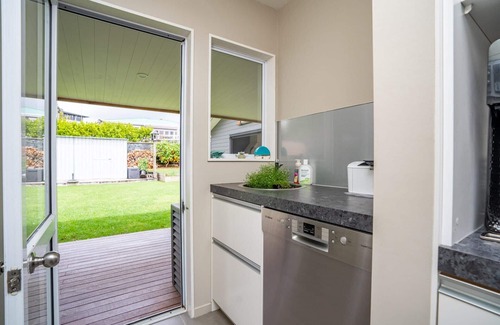 Mangawhai Heads House | Coastal Charmer - Modern holiday home with multiple covered outdoor entertaining spaces and spa