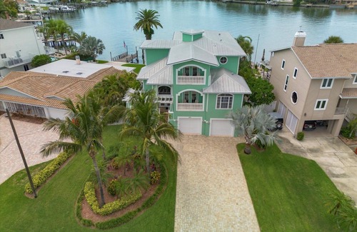 Indian Rocks Beach House | Coastal Elegance: Retreat with Heated Pool, Golf Cart, and Entertainment Haven