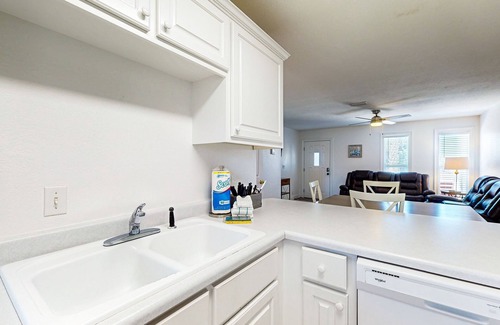 Port St. Joe House | Coastal getaway steps from the bay with patio, open layout, smart TVs, & W/D