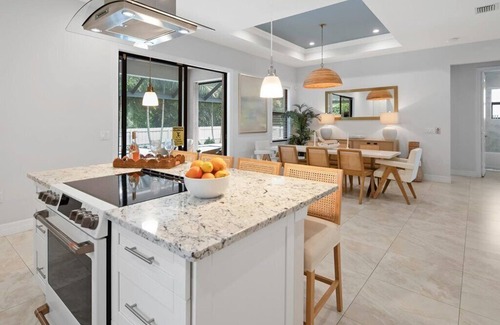 Central Naples House | COASTAL LUXURY 4BD HOME W POOL, PRIME LOCATION 5 MIN TO TOP BEACHES AND DOWNTOWN