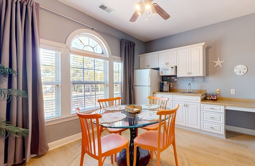 Sea Trail Apartment | Coastal Suite with golf course view and shared pool access