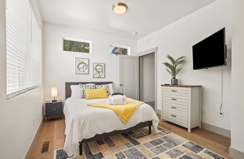 Southeast Boise House | Colorful Canvas: Relax in Grey, Yellow, and Blue