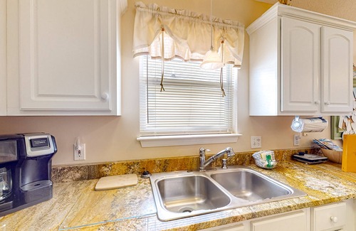 Panama City Beach Cottage | Colorful home near the beach with 2 pools, bikes, beach gear, W/D, & AC