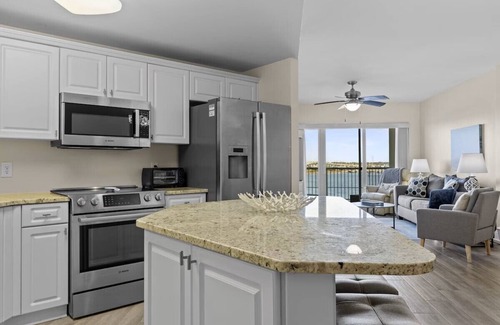 Morehead City Condo | Come watch the Dolphin play! Pool, Jacuzzi, & Gym Walking distance to the Beach!