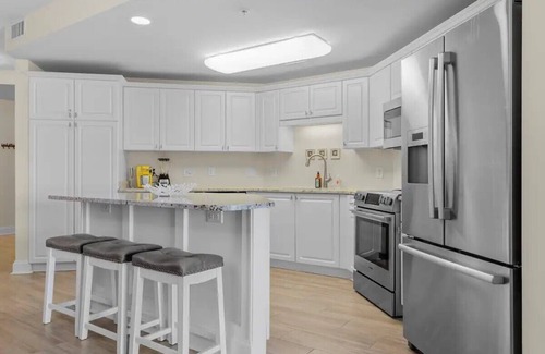 Morehead City Condo | Come watch the Dolphin play! Pool, Jacuzzi, & Gym Walking distance to the Beach!