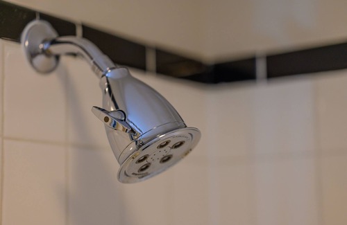 Stowe Bed & Breakfast | Comfortable, pet friendly room with queen bed, a stunning view of Mount Mansfield, sitting area and a fireplace with full service breakfast included