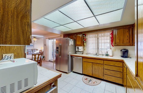 Sun City House | Comfortable stay with a pool, tennis court, and gym access, washer/dryer, & AC