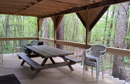 Huntingdon House | Comfy cabin in the woods with huge party deck