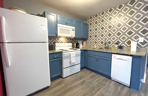 West End House | Comfy Luxe Villa Downtown with Custom Mural