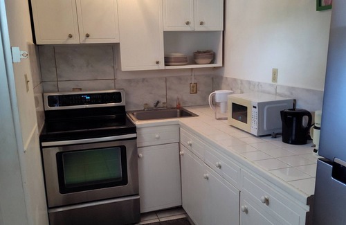 Kittian Village Condo | Condo - 2 beds with WiFi, AC, Pool and Oceanfront in charming Frigate Bay.
