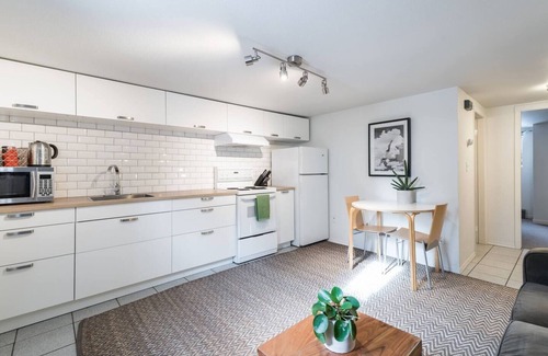 Kensington-Cedar Cottage House | Cool, cozy and modern space with a garden patio to enjoy meals in sunny weather.