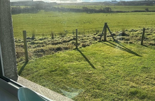 Bushmills House | Cosy coastal bungalow in Portballintrae. Five minute drive to portrush.