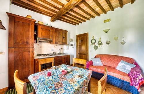 Passignano sul Trasimeno Apartment | Cosy flat equipped with all comforts to comfortably accommodate up to 3 people. The accommodation is located in a renovated former oil mill, which offers its guests numerous shared facilities: access to the seasonal swimming pool, green area with barbecu