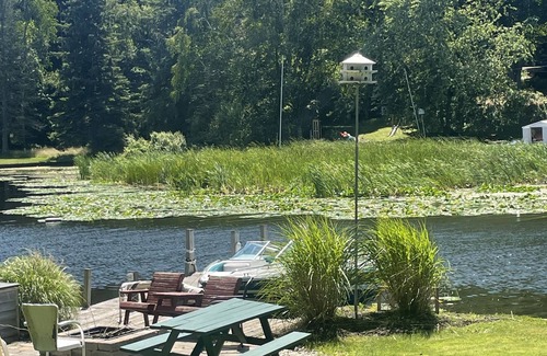 Ludington Cottage | Cottage 4 is a charming 2 bedroom 25’ from your boat dock & Hamlin lake