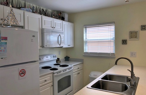 Navarre Beach House | Cozy 1 Bedroom Townhome with a pool and just steps from the beach.