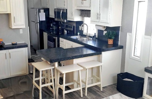 Ocean Ridge Of Brevard House | Cozy 1-bedroom tiny home in beautiful Melbourne Beach with the beach & pools!