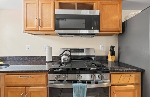 Columbia Heights House | Cozy 2 bedroom/1.5 bathroom English basement townhome. Spacious, safe, and family-friendly with open kitchen, dining area, and crib. Easy access to shops, restaurants, and DC attractions.