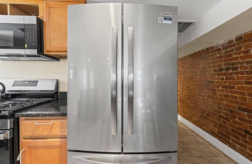 Columbia Heights House | Cozy 2 bedroom/1.5 bathroom English basement townhome. Spacious, safe, and family-friendly with open kitchen, dining area, and crib. Easy access to shops, restaurants, and DC attractions.