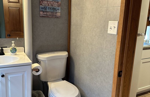 Rhinelander Resort | Cozy 3-bedroom cabin on Wisconsin River Chain -n200' from the Beach Bar & Grill