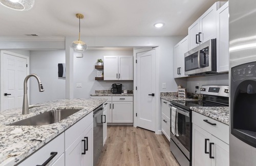 Layton House | Cozy basement with large yard