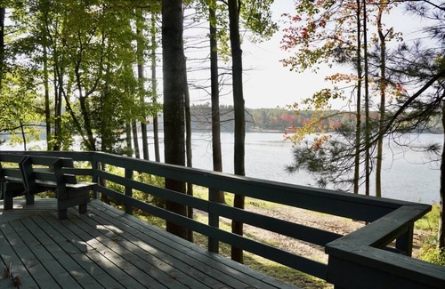 Elmira Cottage | Cozy beachfront cottage in the woods with walkout basement and wrap-around porch