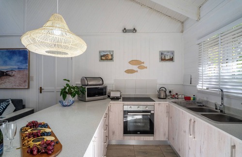 Old Place Cabin | Cozy cabin in beautiful Knysna South Africa by the lagoon with WiFi, heated pool