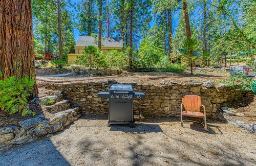West Village Cabin | Cozy cabin in the trees with deck, grill, wood-burning fireplace, WiFi, & W/D