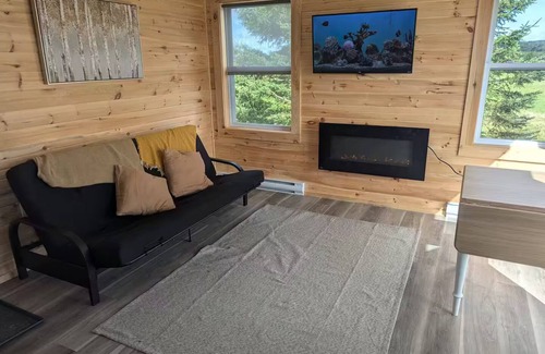 Onslow Cabin | Cozy Cabin overlooking rolling fields, goats, chickens, ducks, and more,