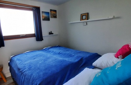 Kortgene Ski Chalet | Cozy chalet in a holiday park for children and water sports enthusiasts with a lake view