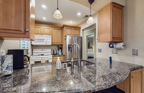 Ocean Woods Condo | Cozy condo with private patio, shared pool, sauna, grill, wifi and W/D