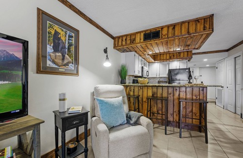 Chalet Village Condo | Cozy Condo with Wood-burning FP & Patio Gliders