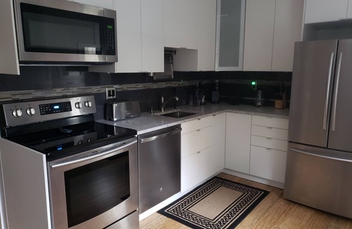 Kitsilano Apartment | Cozy garden suite for six in beautiful Kits Point, half a block from Kits Beach.