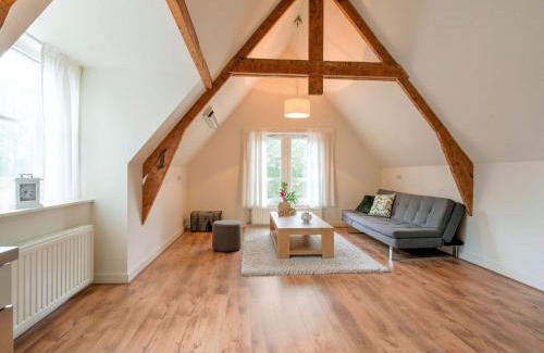 Municipality of Westerveld House | Cozy Holiday Home by the Canal in Dwingeloo