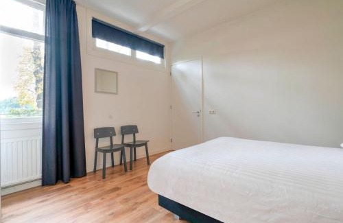 Municipality of Westerveld House | Cozy Holiday Home by the Canal in Dwingeloo