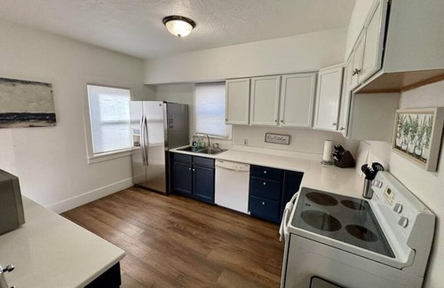 Sioux Falls House | Cozy home near Premier Center, Downtown & Hospital: 65"TV & Fenced Yard-Sleeps 7
