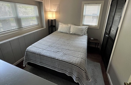 Sister Lakes House | Cozy Lakefront Cottage with Sunset Views, Private 60ft Dock & Water Toys