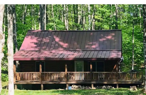 Bellaire Cabin | Cozy Log Cabin in a Quiet Beautiful Wooded Setting