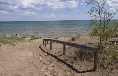 Sturgeon Bay Cabin | Cozy Log Cabin ON THE WATER with the Best Sand Beach in Door County!