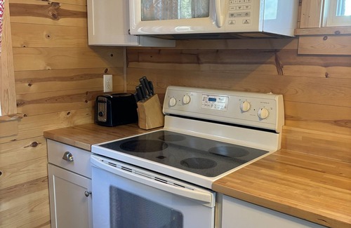 Clear Lake House | Cozy red cabin on Briggs Lake Chain w/boat house