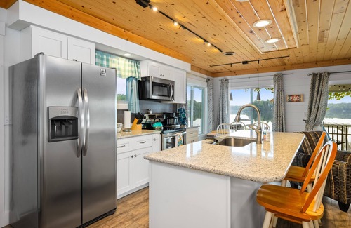 Traverse City Cottage | Cozy remodeled cottage directly on Bass Lake. Ten minutes to Traverse City.