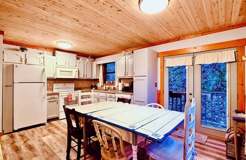 Gatlinburg - Pigeon Forge Cabin | Cozy Riverfront Cabin with Creek Views, Hot Tub, Pool Table, and Fire Pit