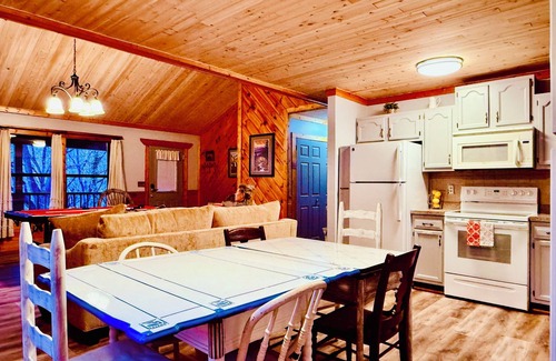 Gatlinburg - Pigeon Forge Cabin | Cozy Riverfront Cabin with Creek Views, Hot Tub, Pool Table, and Fire Pit